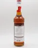 A bottle of Monin Caramel Syrup against a white background. Produktbild-Vorschau