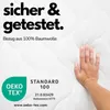 A hand pressing into a white, quilted mattress surface, with marketing text and a certification logo. Produktbild-Vorschau