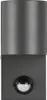 A close-up studio shot of a dark gray outdoor wall light with a motion sensor. Produktbild-Vorschau