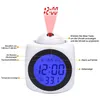 A white cube-shaped digital alarm clock with a blue display and a red projection light showing the time. Produktbild-Vorschau