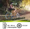 A person is sitting on a mountain bike in a wooded area with autumn leaves. Produktbild-Vorschau