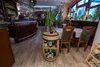 Interior of a restaurant with a wooden barrel wine rack. Produktbild-Vorschau