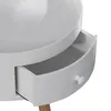Close-up view of a white round nightstand with an open drawer and a wooden leg. Anteprima dell’immagine prodotto