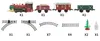 A toy train set with various carriages and track pieces, along with decorative elements like a Christmas tree and a bottle. Produktbild-Vorschau
