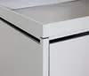 A close-up view of the corner of a light gray metal storage unit, possibly a bicycle garage. Náhled obrázku produktu