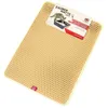 A beige cat litter mat with a honeycomb pattern, placed on a white background. A product label is attached to the top right corner of the mat. Produktbild-Vorschau