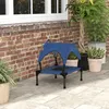 A blue elevated dog bed with a canopy sits on a stone patio next to a brick wall and potted plants. Anteprima dell’immagine prodotto