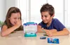 Two children are looking at a small aquarium with live creatures inside. Voir les images du produit