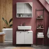 A modern bathroom with a white vanity, sink, mirror, bathtub, and a ladder shelf. Produktbild-Vorschau