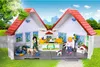 A Playmobil portable pet shop playset set up outdoors with figures and animals. Produktbild-Vorschau
