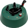 A green Christmas tree stand with gold star accents and a red and white water level indicator. Produktbild-Vorschau