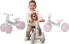 A child is sitting on a balance bike, with two other balance bikes displayed on either side. Náhľad obrázku produktu