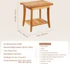 A teak wood shower stool with a shelf, shown from a slightly elevated front-left angle, with dimensions and package content details provided in text boxes below. Podgląd zdjęcia produktu