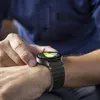 A person is checking their smartwatch. Náhled obrázku produktu