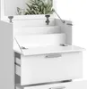 A close-up view of a white vanity table with drawers and a mirror. Náhľad obrázku produktu