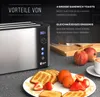A toaster with a plate of toast, fruit, and a cup of coffee. Produktbild-Vorschau