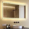 A bathroom scene featuring a large illuminated mirror above a sink. Produktbild-Vorschau