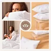 A collage of images showcasing pillows and a woman interacting with bedding. Produktbild-Vorschau