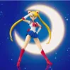 Sailor Moon action figure posing in front of a crescent moon and starry sky. Produktbild-Vorschau