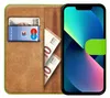 A book-style phone case with a phone inside, showing cards and euro banknotes. Podgląd zdjęcia produktu