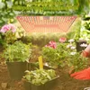 A grow light illuminating plants in a garden setting. Náhľad obrázku produktu