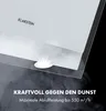 A close-up marketing image of a white range hood with integrated LED lights, showing smoke being drawn upwards. Text overlays highlight its power and performance. Produktbild-Vorschau