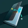 A smartphone case is shown with a flip cover partially open, revealing the phone screen. Arrows indicate the opening and closing motion, and lightbulb icons suggest smart features like wake-up/sleep functionality. Produktbild-Vorschau