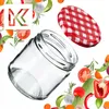 A clear glass jar with a red and white checkered lid, surrounded by fresh vegetables and herbs. Anteprima dell’immagine prodotto