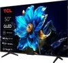 A TCL QLED TV displaying a vibrant blue flower with water droplets, set against a dark, rocky background. Náhled obrázku produktu