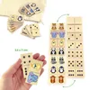 A collage of images showing wooden dominoes with animal illustrations and dots, along with a size indicator. Produktbild-Vorschau