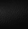 A close-up view of black faux leather texture. Podgląd zdjęcia produktu