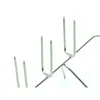 Close-up of several metal hooks with sharp points. Produktbild-Vorschau