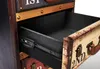 A close-up view of an open drawer in a vintage-style storage unit. Podgląd zdjęcia produktu