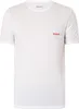 A white t-shirt with a small red logo on the chest. Produktbild-Vorschau