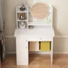 A white vanity table with shelves, a mirror, and drawers, decorated with a few items. Podgląd zdjęcia produktu