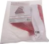 A Santa hat is shown inside a clear plastic bag, with a product label visible. Podgląd zdjęcia produktu
