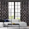A living room scene with a sofa, curtains, and a coffee table. Produktbild-Vorschau