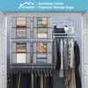 A closet interior with shelves and hanging clothes, showcasing stackable storage bags filled with folded items and stuffed animals. Voir les images du produit