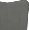 A close-up view of a dark grey velvet armchair. Náhled obrázku produktu