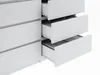 A close-up view of a white dresser with several drawers partially open, revealing the interior. Produktbild-Vorschau