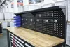 A workshop workbench with a pegboard back and storage bins. Produktbild-Vorschau