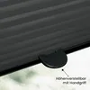 A close-up of a black pleated blind with a height adjustment handle and text indicating it is height-adjustable with a handle. Produktbild-Vorschau