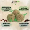 Three bird feeder balls in green netting are displayed on a light beige background, surrounded by text boxes highlighting product features and a few dried fruits. Produktbild-Vorschau