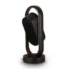 A side view of a black and brown fan or heater. Anteprima dell’immagine prodotto