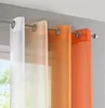 Close-up view of sheer curtains with a color gradient hanging on a curtain rod. Produktbild-Vorschau
