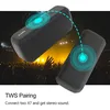 Two black portable speakers are shown in front of a crowd at a concert, with glowing blue circles indicating a TWS pairing connection. Produktbild-Vorschau