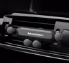 A car phone holder mounted on a car's air vent. Náhľad obrázku produktu