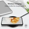 A smartphone is placed on a wireless charger next to a laptop, with text overlay indicating wireless charging capabilities. Produktbild-Vorschau