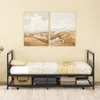 A twin-sized daybed with storage underneath, set against a neutral wall with two landscape paintings. Produktbild-Vorschau