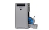 A light gray Sharp air purifier with a blue filter partially pulled out from a compartment on the right side. Podgląd zdjęcia produktu